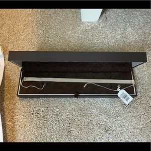 Never worn, with tags and box!